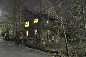 Witch house on the hill at night
