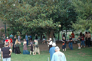 Asheville citizens circling magnolia tree